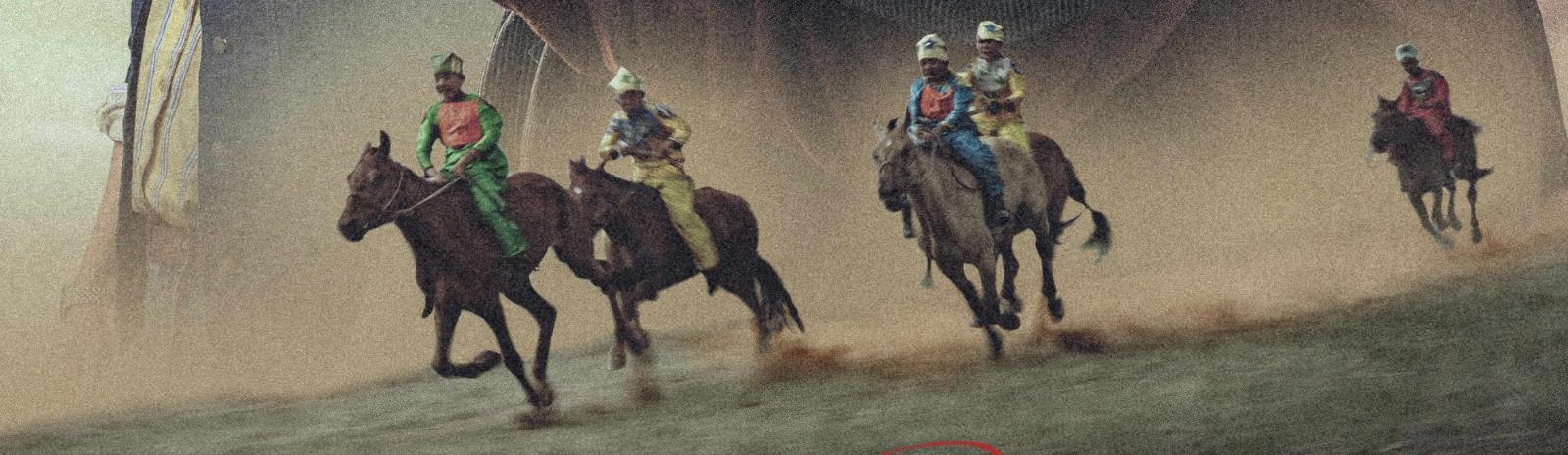 Boy jockeys race across the steppe